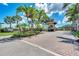 Gated entrance to Villa Milano community with palm trees at 2148 La Palma Ave, Port Charlotte, FL 33953