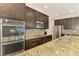 Modern kitchen with stainless steel appliances and granite countertops at 2148 La Palma Ave, Port Charlotte, FL 33953