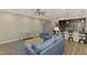 Open living area with modern sofas and a kitchen island at 2148 La Palma Ave, Port Charlotte, FL 33953