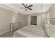 Main bedroom with large bed, dresser, and access to another room at 2148 La Palma Ave, Port Charlotte, FL 33953