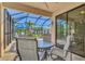 Covered patio with seating area, overlooking the pool at 2148 La Palma Ave, Port Charlotte, FL 33953
