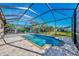 Enjoy this lovely screened pool and spa with a spacious deck at 2148 La Palma Ave, Port Charlotte, FL 33953