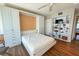 Bedroom with wall bed, built-ins, and hardwood floors at 2255 N Beach Rd # 9, Englewood, FL 34223