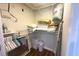 Well-organized linen closet with ample shelving and hanging space at 2255 N Beach Rd # 9, Englewood, FL 34223