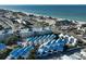 Aerial view of coastal community featuring beach, ocean, and modern homes at 2255 N Beach Rd # 9, Englewood, FL 34223