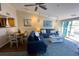 Spacious living room with comfortable seating, large windows and water views at 2255 N Beach Rd # 9, Englewood, FL 34223