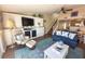 Living room with comfy seating, built-in entertainment center and hardwood floors at 2255 N Beach Rd # 9, Englewood, FL 34223