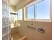 Walk in shower with glass block wall and water views at 2255 N Beach Rd # 9, Englewood, FL 34223