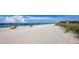Beachfront view with people enjoying the sand and ocean at 2255 N Beach Rd # 9, Englewood, FL 34223