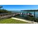 Private wooden dock with access to the waterway at 2255 N Beach Rd # 9, Englewood, FL 34223
