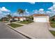 Home exterior view with attached garage at 27168 Ipswich Dr, Englewood, FL 34223