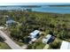 Wide aerial view of a waterfront property with multiple mobile homes at 2930 Waterside Dr, Englewood, FL 34224