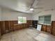 A bedroom undergoing renovation, showcasing exposed walls and new flooring at 2930 Waterside Dr, Englewood, FL 34224