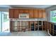 A kitchen currently under renovation, showcasing new cabinets and a microwave at 2930 Waterside Dr, Englewood, FL 34224