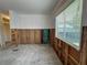Renovation project: A kitchen needing complete remodeling, showing exposed framing and plumbing at 2930 Waterside Dr, Englewood, FL 34224
