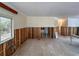 Living room undergoing renovation with exposed framing and new flooring at 2930 Waterside Dr, Englewood, FL 34224