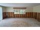 Living room with damaged walls, showing framing and wires at 2930 Waterside Dr, Englewood, FL 34224