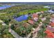 Aerial view of a home community near water at 3300 Pennyroyal Rd, Port Charlotte, FL 33953