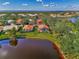 Aerial view showcasing a home with a pool and desirable landscaping at 3300 Pennyroyal Rd, Port Charlotte, FL 33953