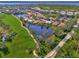 Aerial view of upscale community with golf course and waterways at 3300 Pennyroyal Rd, Port Charlotte, FL 33953