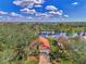 Single-Gathering home with a red tile roof and a pond view at 3300 Pennyroyal Rd, Port Charlotte, FL 33953