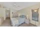 Primary bedroom with backyard view and ceiling fan at 3300 Pennyroyal Rd, Port Charlotte, FL 33953