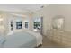 Bright bedroom with sliding doors to lanai and pool view at 3300 Pennyroyal Rd, Port Charlotte, FL 33953