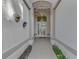 Elegant entryway with arched doorway and decorative wrought iron at 3300 Pennyroyal Rd, Port Charlotte, FL 33953
