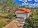 Single-story home with attached garage and landscaping at 3300 Pennyroyal Rd, Port Charlotte, FL 33953