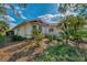 Single-story home with landscaping and a bay window at 3300 Pennyroyal Rd, Port Charlotte, FL 33953