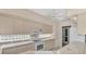 Efficient kitchen with white appliances and glass block backsplash at 3300 Pennyroyal Rd, Port Charlotte, FL 33953
