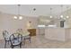 Kitchen with breakfast nook, light-toned cabinetry, and a tiled floor at 3300 Pennyroyal Rd, Port Charlotte, FL 33953