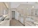 Bright kitchen with white appliances and a view into the dining area at 3300 Pennyroyal Rd, Port Charlotte, FL 33953