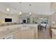 Bright kitchen features breakfast nook and view to backyard pool at 3300 Pennyroyal Rd, Port Charlotte, FL 33953