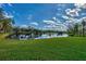 Serene lake view with lush green landscape at 3300 Pennyroyal Rd, Port Charlotte, FL 33953