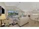 Living room with vaulted ceilings, neutral decor, and pool view at 3300 Pennyroyal Rd, Port Charlotte, FL 33953