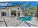 Inviting pool area with screened enclosure, perfect for relaxation at 3300 Pennyroyal Rd, Port Charlotte, FL 33953