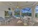 Relaxing screened-in pool area with seating and dining at 3300 Pennyroyal Rd, Port Charlotte, FL 33953