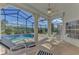 Screened-in pool and patio with outdoor furniture at 3300 Pennyroyal Rd, Port Charlotte, FL 33953