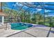 Inviting kidney-shaped pool with screened enclosure at 3300 Pennyroyal Rd, Port Charlotte, FL 33953