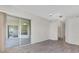 Bedroom with sliding glass doors leading to a private patio at 3392 Pennyroyal Rd, Port Charlotte, FL 33953