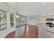 Breakfast nook with hardwood floors and view to kitchen at 3392 Pennyroyal Rd, Port Charlotte, FL 33953