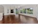 Bright dining area with hardwood floors and view to the backyard at 3392 Pennyroyal Rd, Port Charlotte, FL 33953