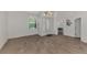 Bright dining room with hardwood floors and entryway view at 3392 Pennyroyal Rd, Port Charlotte, FL 33953