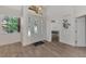 Bright entryway with tile floors and a glass front door at 3392 Pennyroyal Rd, Port Charlotte, FL 33953