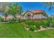 Side view of the house showcasing its landscaping and exterior at 3392 Pennyroyal Rd, Port Charlotte, FL 33953