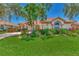 Beautiful home with lush landscaping and a tile roof at 3392 Pennyroyal Rd, Port Charlotte, FL 33953