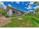 House exterior showcasing the back of the home and landscaping at 3392 Pennyroyal Rd, Port Charlotte, FL 33953