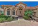 Front entrance with columns, arched windows and a tile roof at 3392 Pennyroyal Rd, Port Charlotte, FL 33953