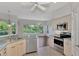 Kitchen with stainless steel appliances and view to the dining area at 3392 Pennyroyal Rd, Port Charlotte, FL 33953